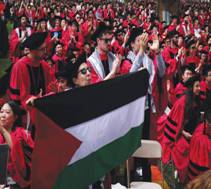  A PALESTINIAN FLAG is displayed as graduating students at Commencement Exercises at Harvard University rise in support of 13 students not allowed to graduate because of their participation in pro-Palestinian protests last May. (photo credit: BRIAN SNYDER/REUTERS)